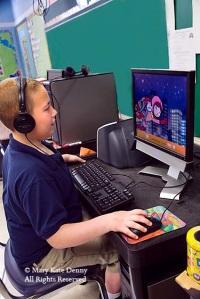 Autistic boy 7+ runs computer in class